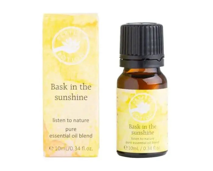 Bask in the Sunshine Essential oil bottle shown with its packaged yellow box.