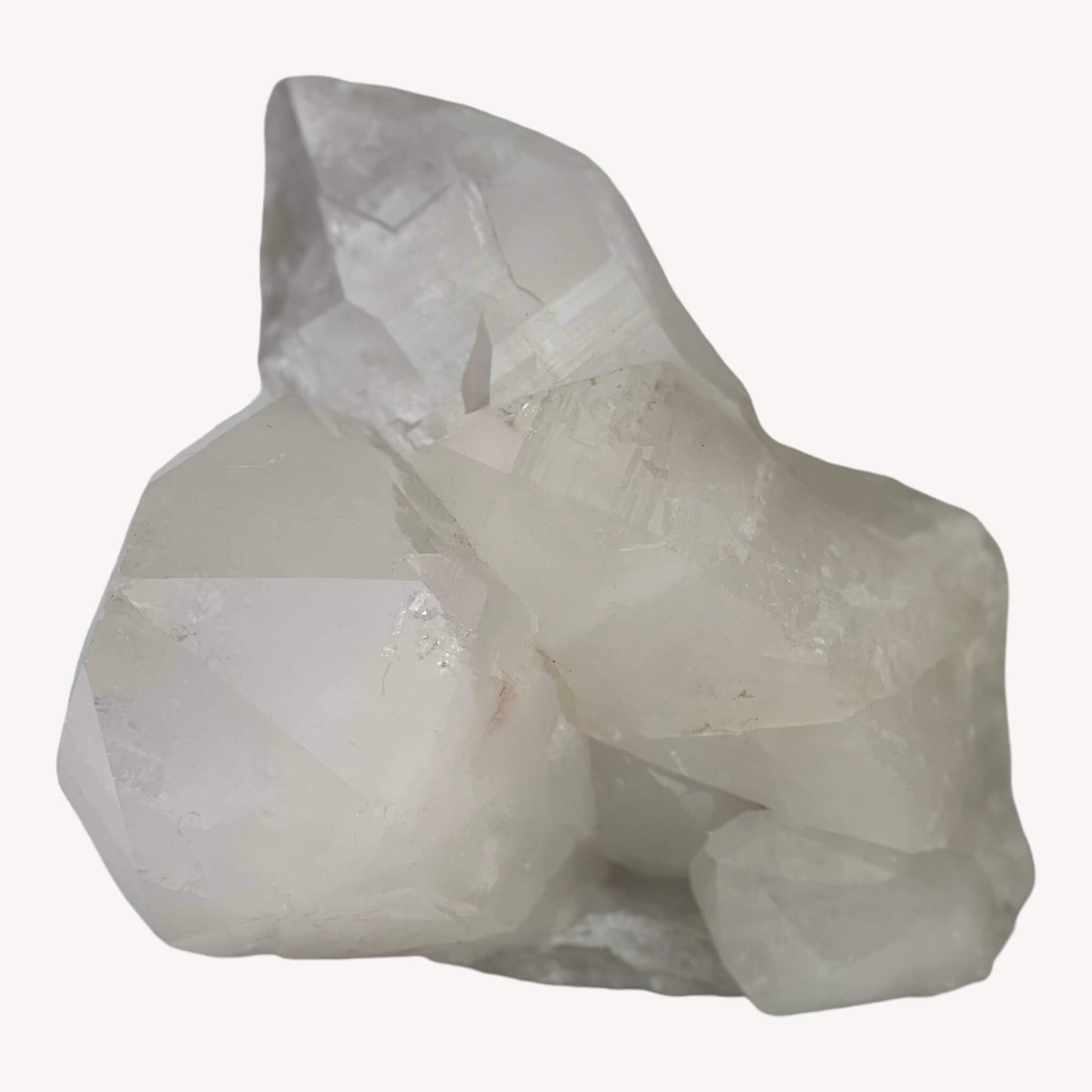 Front view of a mesmerizing Clear Quartz crystal cluster. The intricate formations and sparkling points showcase the natural beauty of this cluster, perfect for enhancing positive energy and clarity.