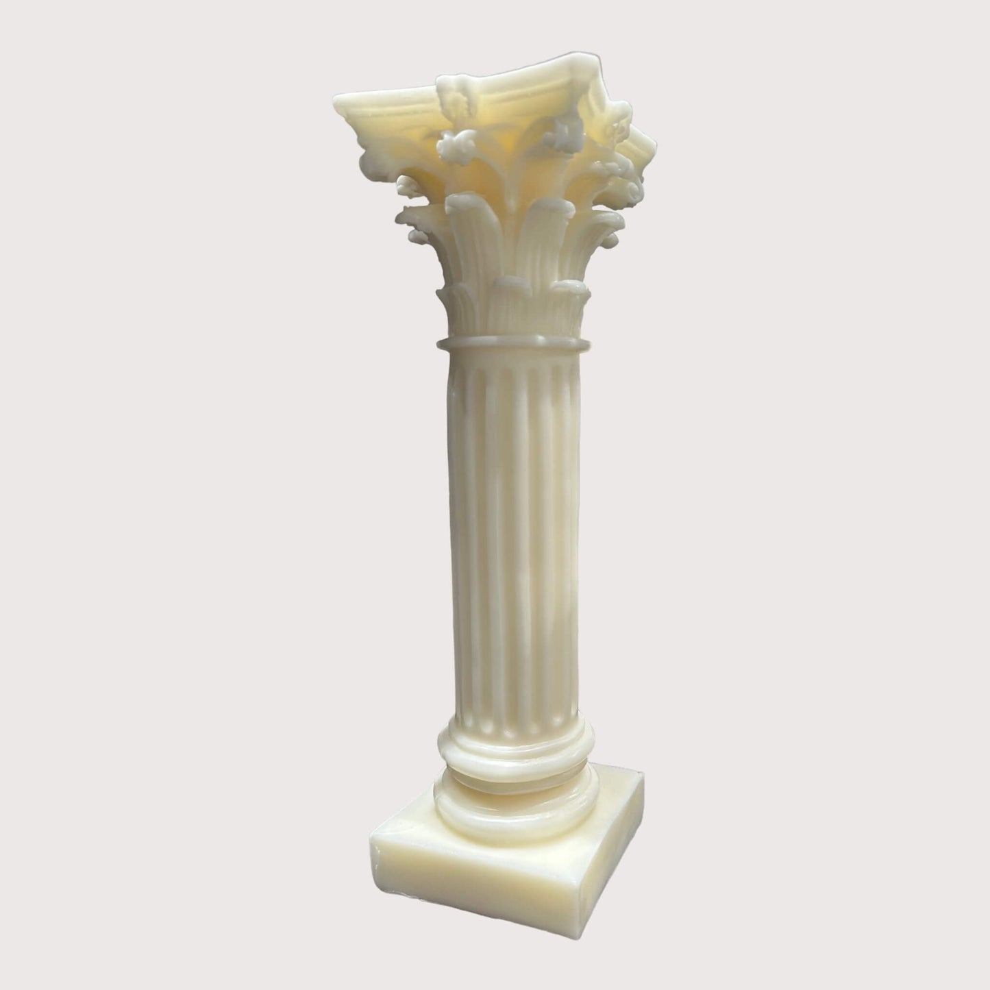 Front view of the Corinthian Pillar Candle by With Love Ally. A stunning statement piece, measuring 30cm in length, 9cm in width, and 9cm in height. Crafted from a sustainable beeswax blend, this unscented candle is perfect for adding elegance to any space.