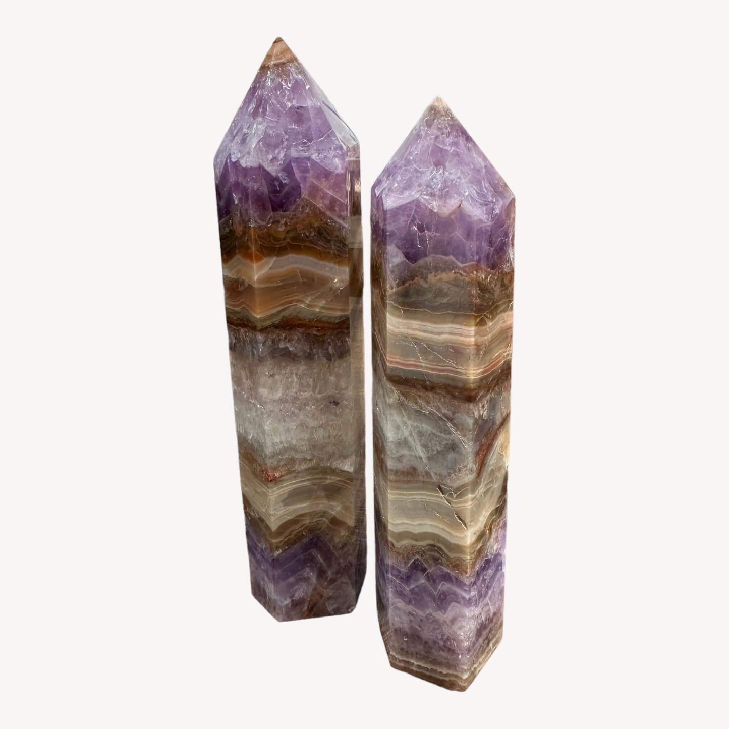 wo Crystal Generators in one image: Crazy Lace Agate and Amethyst. Sizes include 16.5cm and 18cm, showcasing the unique beauty of each crystal. A harmonious blend of natural patterns and vibrant colors."