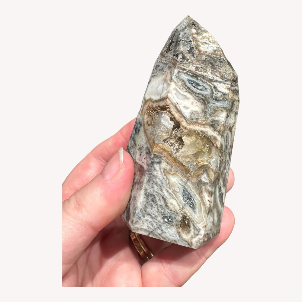 
                  
                    ide view of the Druzy Agate Crystal Generator held in hand. The crystal's size and details are emphasized, showcasing its beauty and providing a sense of scale. Perfect for those who appreciate the unique charm of druzy formations.
                  
                