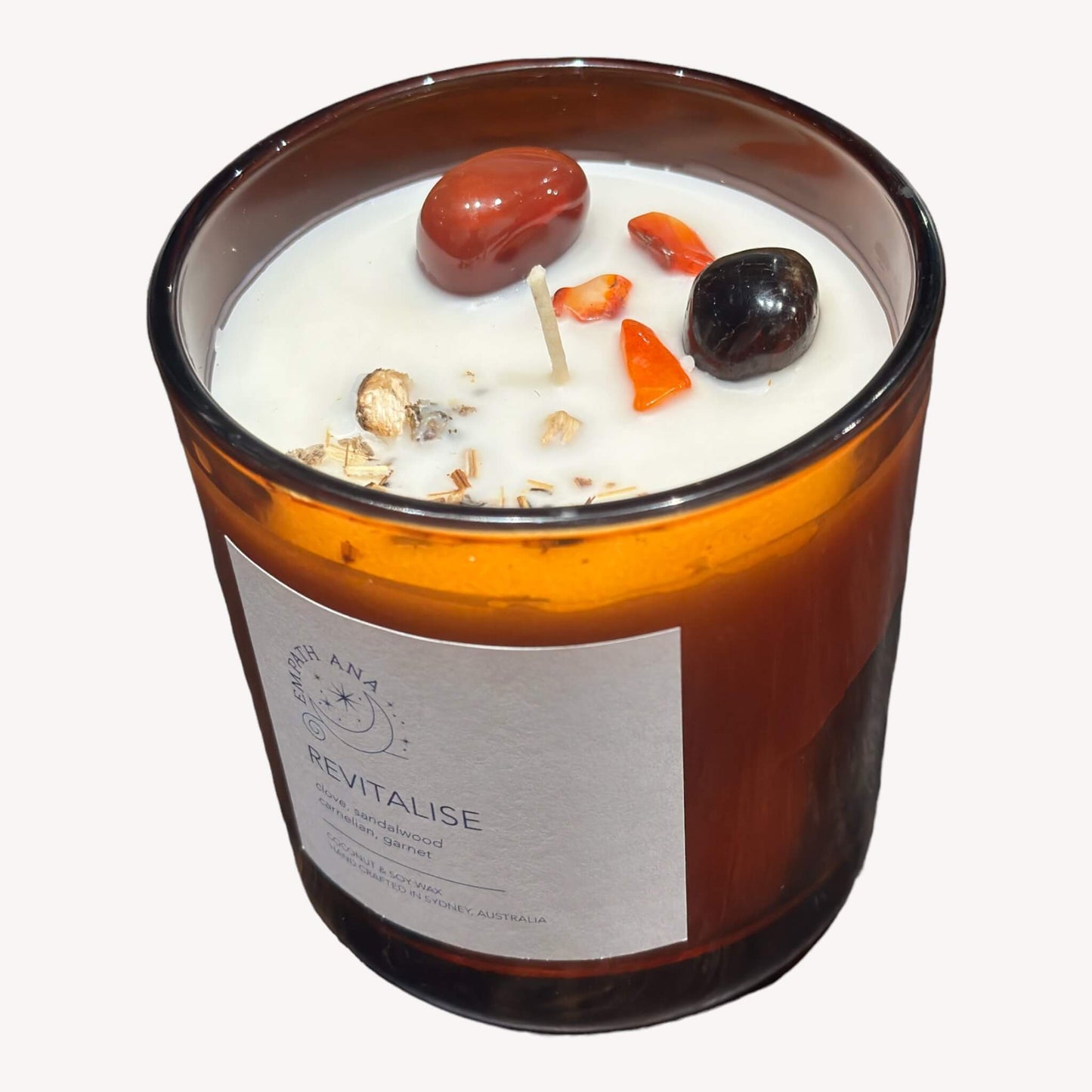 
                  
                    Top View of Large Revitalise Crystal Candle - Energizing Carnelian and Garnet Crystals.
                  
                