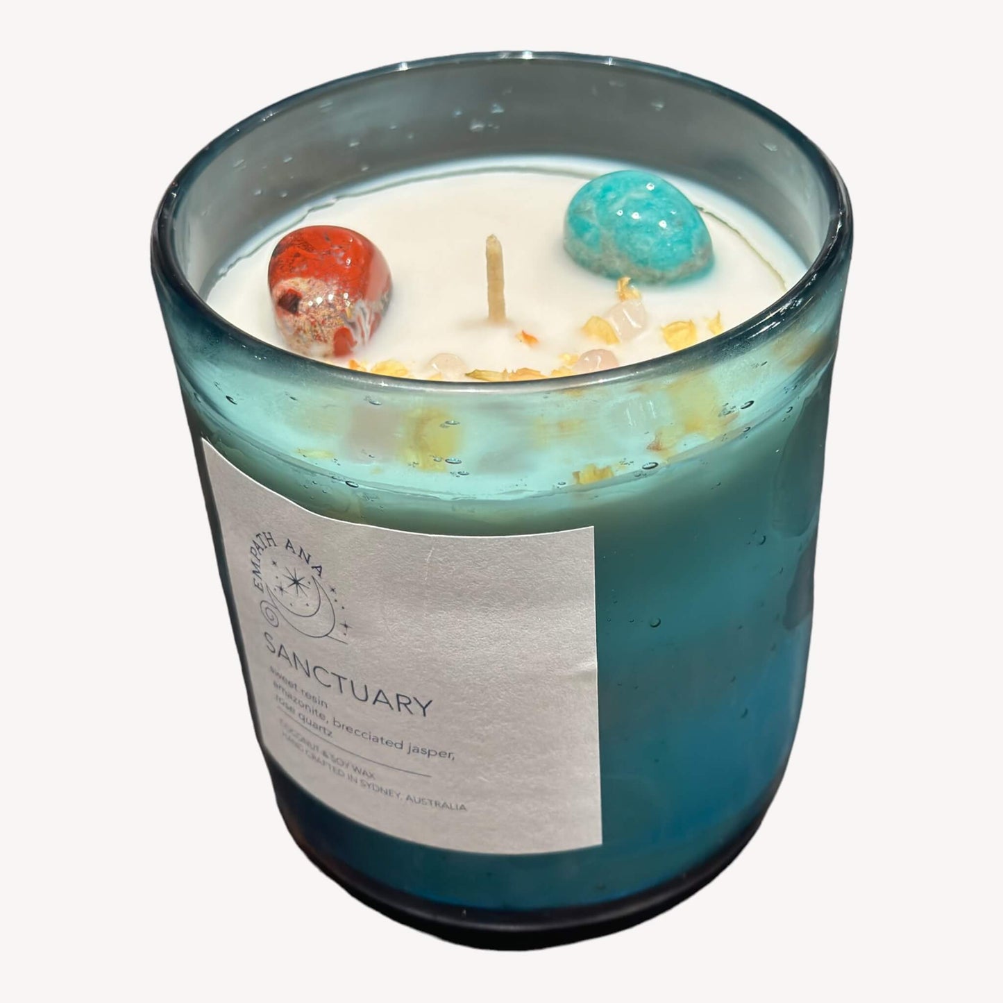 Top of Large Sanctuary Crystal Candle: Overhead view, highlighting the trio of Amazonite, Brecciated-Jasper, and Rose Quartz crystals within the coconut/soy wax. Large size (400mls).