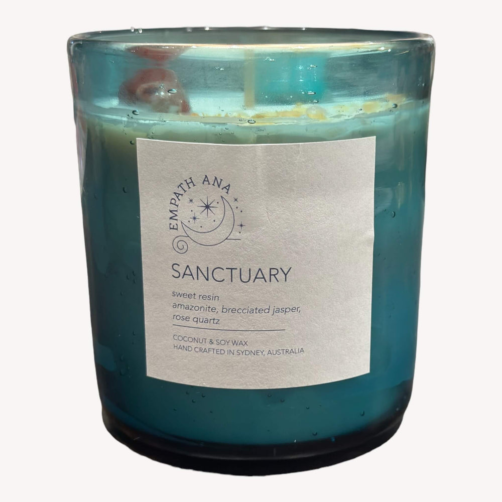 Front of Large Sanctuary Crystal Candle: A serene crystal candle by Empath Ana, topped with Amazonite, Brecciated-Jasper, and Rose Quartz crystals, infused with a sweet resin fragrance. Large size (400mls).