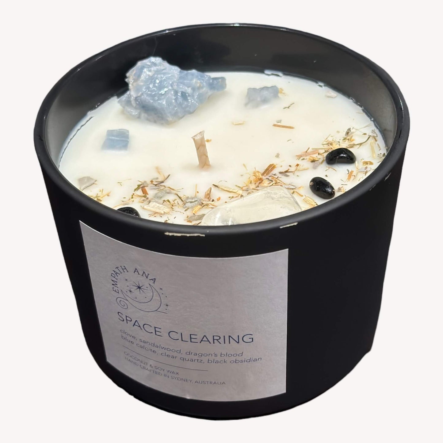 
                  
                    The top view of the X-Large Space Cleearing Crystal Candle, highlighting the intricate crystal and herb decorations.
                  
                