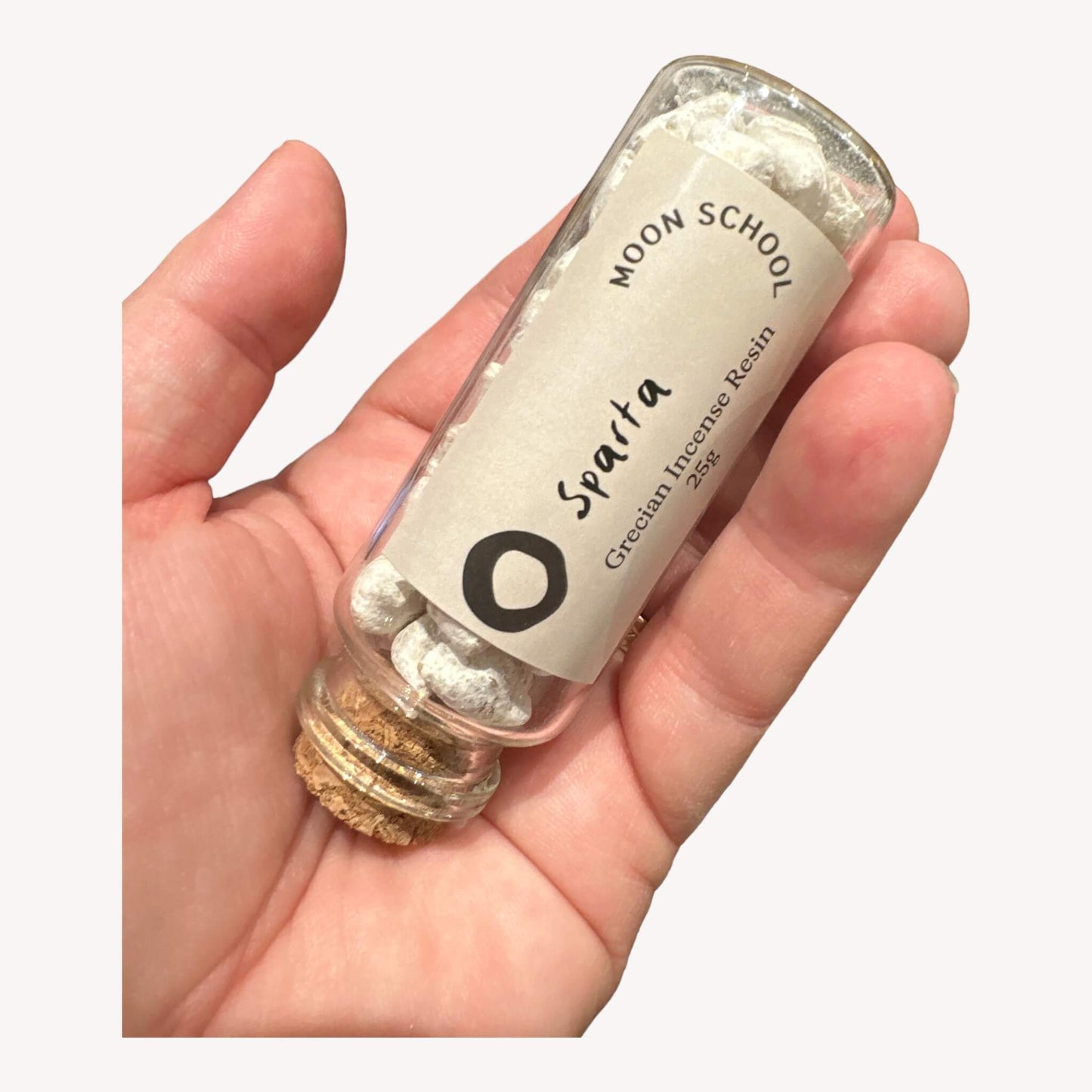 Bottle of 'Sparta' Incense Resin held in hand. Elevate your surroundings with the commanding essence of Sparta. Designed to evoke feelings of determination and fortitude, creating an ambiance that echoes the strength and resilience of Spartan warriors.