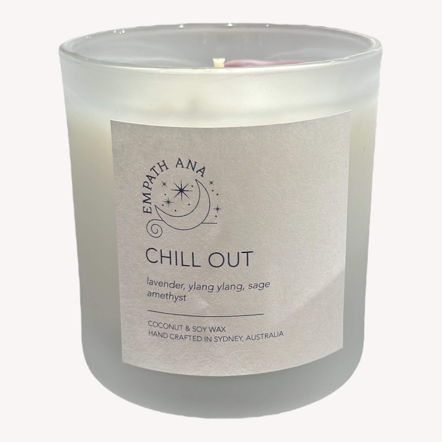 Front view of Empath Ana's Chill Out Crystal Candle in the Medium size (200 mls). The jar is adorned with Amethyst crystals, offering a serene and calming aesthetic.