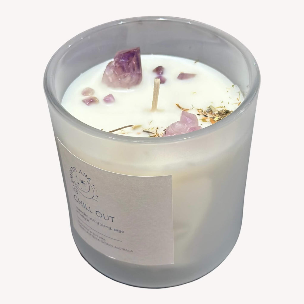 
                  
                    Top view of Empath Ana's Chill Out Crystal Candle in the Large size (400 mls). Clear Quartz crystals, Amethyst, and calming herbs create a visually enchanting scene, enhancing the ambiance and positive energy.
                  
                