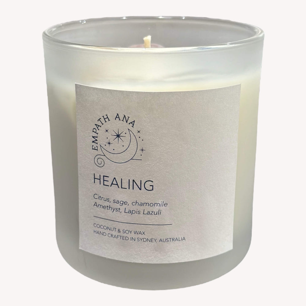 Empath Ana's Healing Intention Crystal Candle - Front view of a 200ml frosted glass jar candle with a label featuring the product name and relevant details. The candle exudes a sense of serenity and healing.